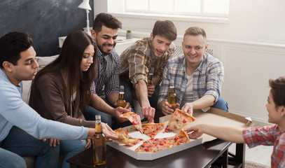 Group of young multiethnic friends with pizza
