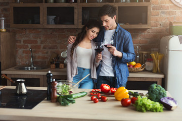 Happy couple cooking healthy food together