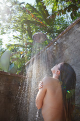 Naklejka premium women in tropic shower