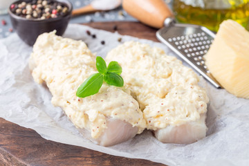 Preparation of cod fillet under cheese, mustard, pepper and cream crust, ingredients on background, horizontal