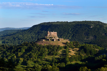 Fototapeta na wymiar A beautiful medieval castle in the mountains, in Auvergne,France.