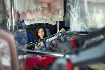 cute little girl on shopping. portrait of a kid with shopping bags. child in dress, sunglasses and shoes near shopping mall having fun.