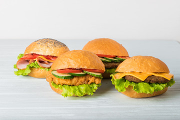 Craft beef burger on wooden table isolated on white background