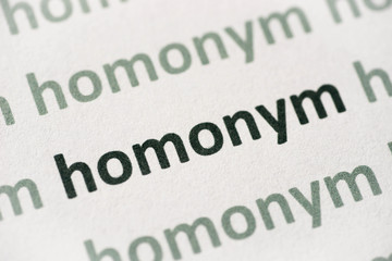 word homonym  printed on paper macro