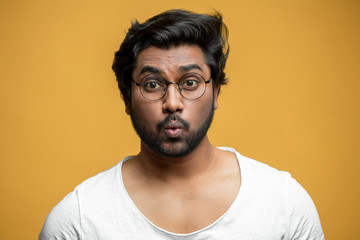 strong Indian guy is learning to whistle. male who has lips like a jigsaw puzzle. hindoo singer...