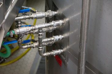 Pipework on the side of a brewing vat