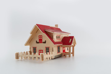 Toy home wood  with fence on white background