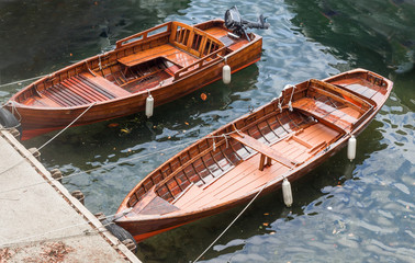 Fototapeta na wymiar vintage wooden boats used to fish on Como Lake, Italy