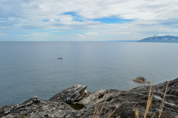 Fototapeta na wymiar A fishing boat against a blue sky, Lake Malawi