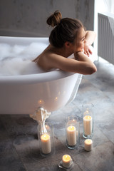 close up side view photo girl waiting for her boyfriend in the bath