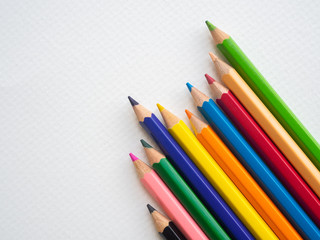 Closeup color pencils isolated on white paper background. Education, Back to school Concept.