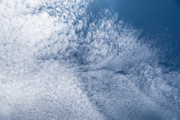 Obraz premium Altocumulus cloudscape on blue blue sky, Beautiful Cirrocumulus or Altocumulus on the middle altitude layer