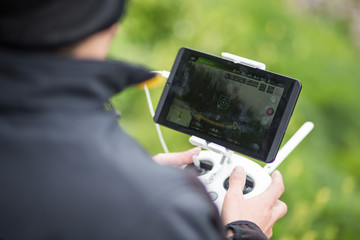 Man using remote control to operating drone