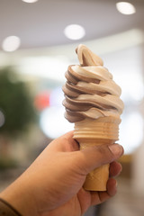 Vanilla and chocolat soft ice cream waffled cone