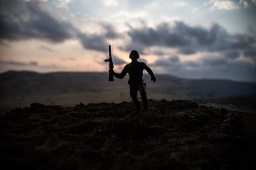 War Concept. Military silhouettes fighting scene on war fog sky background, World War Soldiers Silhouettes Below Cloudy Skyline at sunset. Attack scene. Armored vehicles. German tank in action