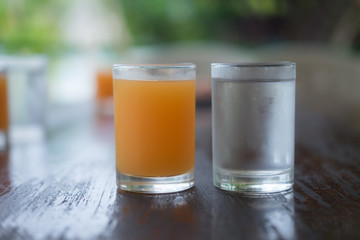 Orange juice near water ice
