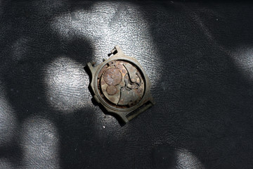 Old rusty watches (clockwork) on black