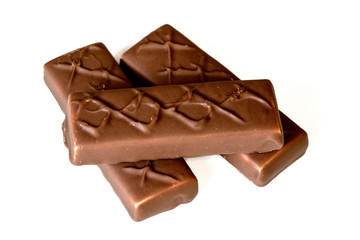 chocolate bars over white background