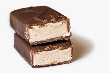 chocolate bars over white background