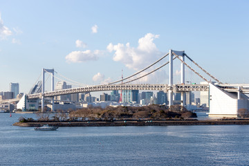 Fototapeta na wymiar Tokyo Bay with Rainbow Bridge in Odaiba city skyline