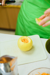 Obraz na płótnie Canvas baked apple stuffed with orange chocolate, stock photo image