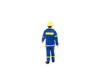 Miniature people engineer worker construction on white background with a space for text