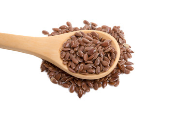 flax seeds in wooden spoon isolated on the white