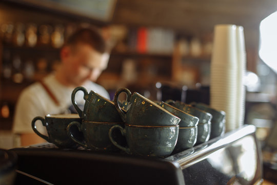 Blue Coffee Cups On The Shelf At The Cafe . Blurred Background