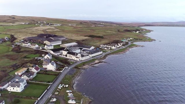 Flying Towards a Distillery in the Isle of Islay by Loch Indaal