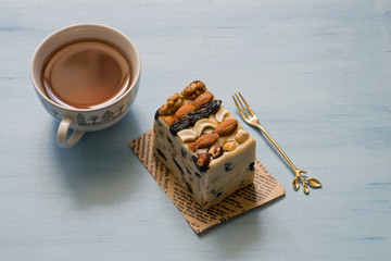 Oriental sweets, halva, sherbet with nuts. Sweet sherbet with nuts. Cup of tea with turkish sweets.