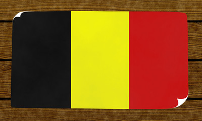 Illustration of an Belgian flag on the papier pasted on the woody wall