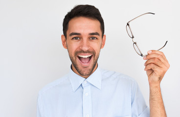 Horziontal closeup portrait of happy unshaven handsome young male with open wide mouth, wins the...