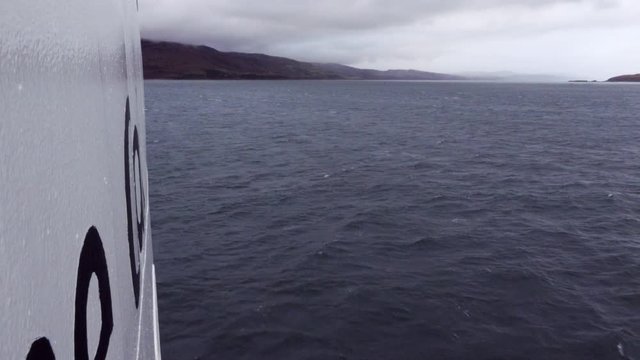 Close Up of a Boat Bow Sailing on a Cloudy Day in Islay Scotland