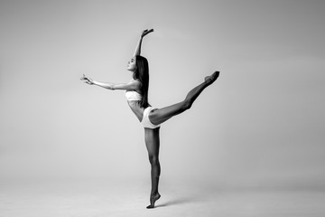 Young woman in a white sport costume, fitness model. © cherry_d