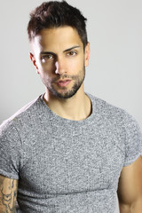 Portrait of an handsome male model posing on studio 