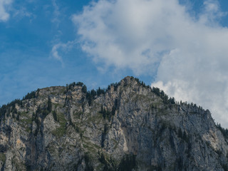 Fototapeta na wymiar Mountain peak and cloudy sky