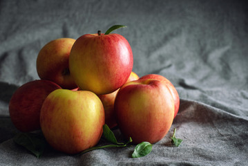Fresh Organic Red Apple on Table with Crumpled Fabric Cover Background - Still Life Photography