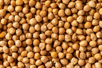 Closeup chickpea groats as a natural food background. Concept of healthy vegetarian diet.