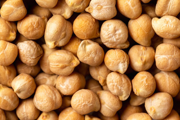Top view macro chickpea groats as a natural food background. Concept of healthy vegetarian diet.