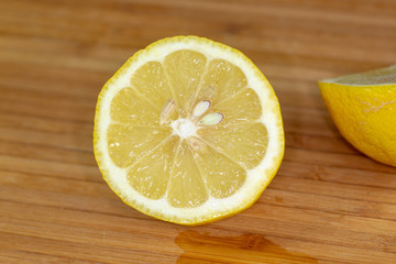 Close up of a lemon sliced in two.