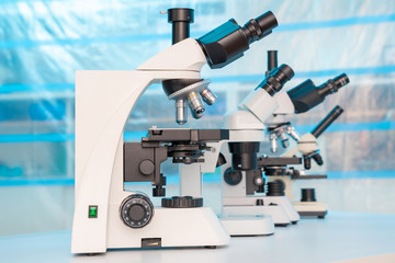 Four microscopes of different designs in the laboratory