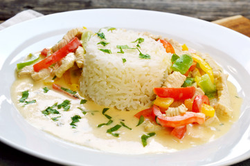 Stir the turkey with cream sauce and paprika 3 colors or Creamy Paprika turkey (German name is Putengeschnetzeltes mit Paprika und Reis).  Healthy and benefits with colorful of Paprika menu. © posinote