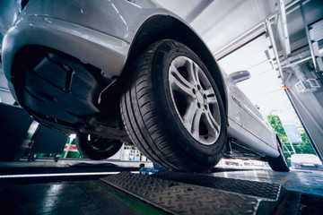 Automotive suspension test and brake test rolls in a auto repair service.