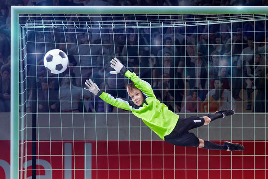goalkeeper jumping for the ball on a crowded stadium