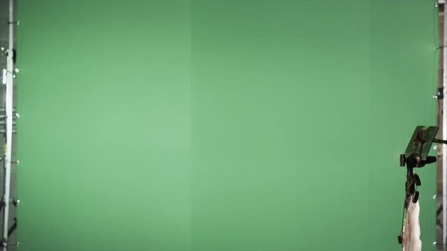 Slow motion blood squibs exploding, spraying blood across the screen on green screen. For use with visual effects and/or design and texturing.