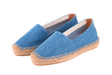 Blue espadrilles on white background
