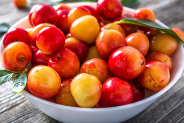 Fresh cherries - yellow berries. Sweet cherries, closeup of fruits in a bowl