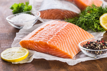 Raw salmon fillet with dill lemon olive oil salt and pepper