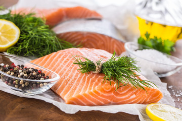 Raw salmon fillet with dill lemon olive oil salt and pepper