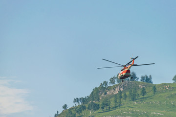 Flying helicopter in the mountains